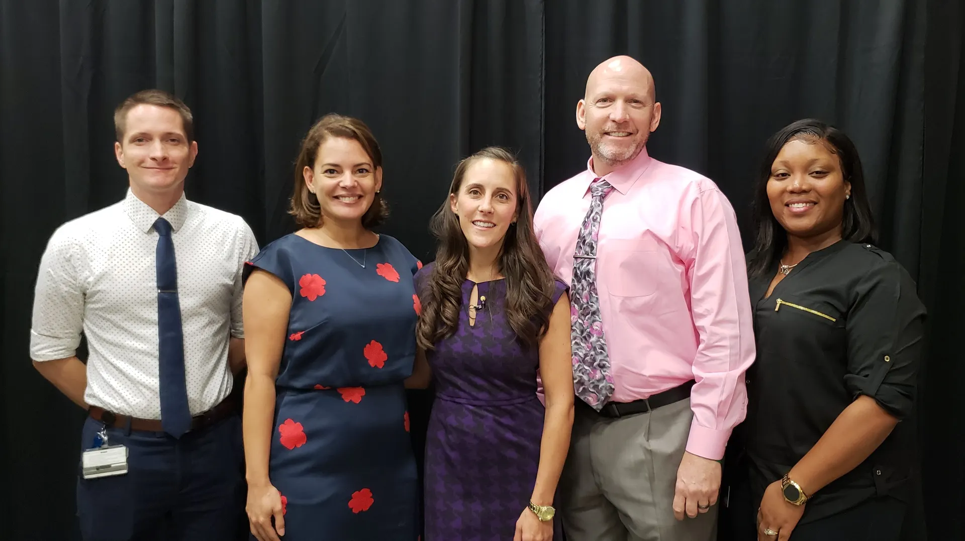Lisa Hamp poses with Broward College Campus Safety team and Central Campus President Sunem Beaton-Garcia
